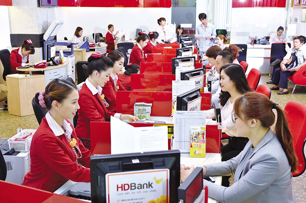 ngân hàng Nhà nước đã chấp thuận việc sáp nhập ngân hàng TMCP Đại Á vào ngân hàng TMCP Phát triển TP.HCM (HDBank)  Ảnh: Đức Thanh