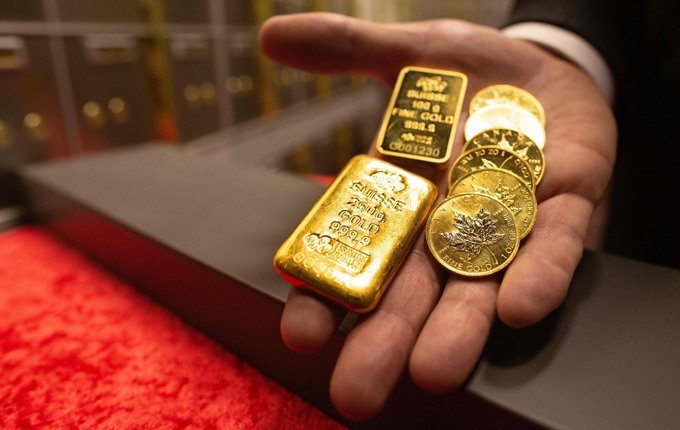 Giá vàng được dự báo cán mốc 2.100 USD/ounce trong năm 2023. Ảnh: AFP