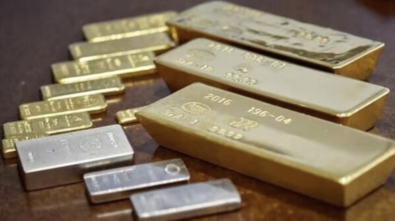 Giá vàng thế giới năm 2024 sẽ được trợ lực bởi chính sách nới lỏng của Cục Dự trữ Liên bang Mỹ (Fed). Ảnh: AFP