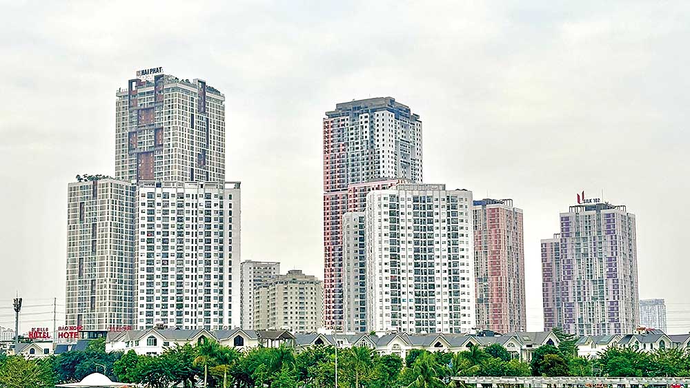 Với việc kiểm so&aacute;t d&ograve;ng vốn t&iacute;n dụng v&agrave; nhiều biện ph&aacute;p kh&aacute;c của Ch&iacute;nh phủ, thị trường địa ốc đ&atilde; hạ nhiệt (Ảnh: P.V)