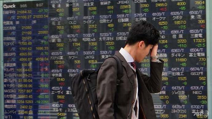 Bóng ma suy thoái kinh tế đè nặng, chứng khoán châu Á đi xuống phiên sáng 2/10. Ảnh: AFP