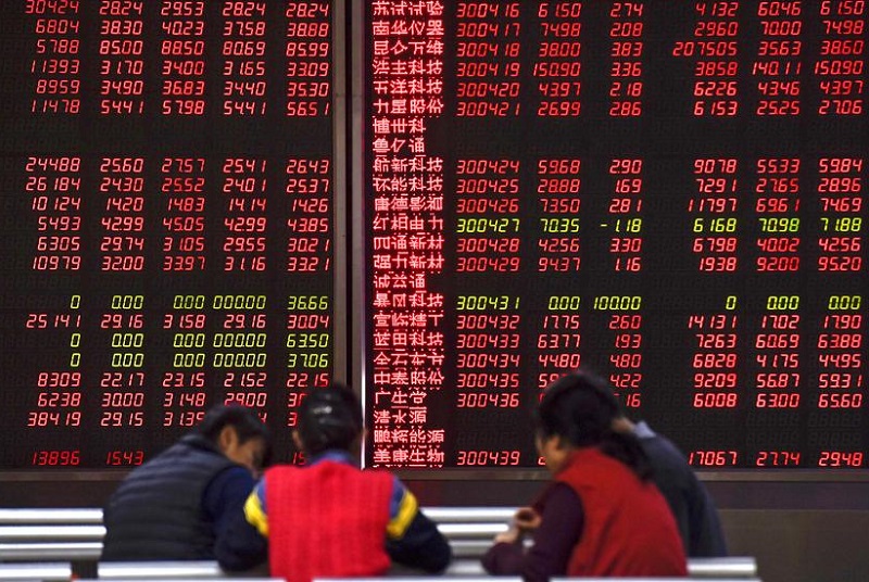 Các chỉ số lớn trên thị trường chứng khoán châu Á đều đi xuống trong phiên sáng nay 4/12. Ảnh: AFP