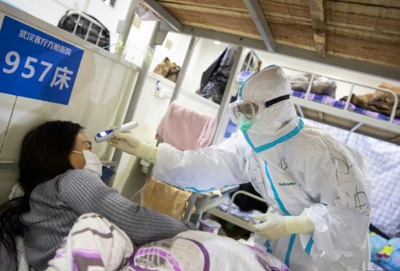 Trung Quốc hôm nay 20/2 thông báo số ca nhiễm Covid-19 mới tại đại lục đã xuống mức thấp nhất kể từ cuối tháng 1 một phần là do thay đổi phương pháp chẩn đoán bệnh tại tâm dịch Hồ Bắc. Ảnh: AFP