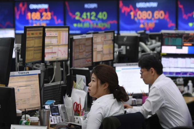 Chứng khoán Hàn Quốc ghi nhận sóng tăng điểm mạnh nhất thị trường châu Á với chỉ số Kospi tăng 1,56%. Ảnh: AFP