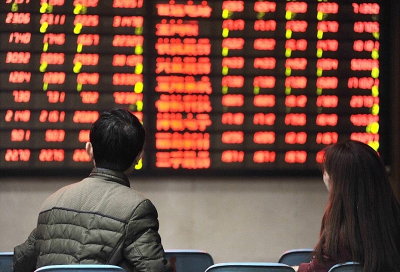 chứng khoán Trung Quốc đại lục dẫn sóng tăng điểm tại khu vực trong phiên giao dịch 5/3. Ảnh: AFP