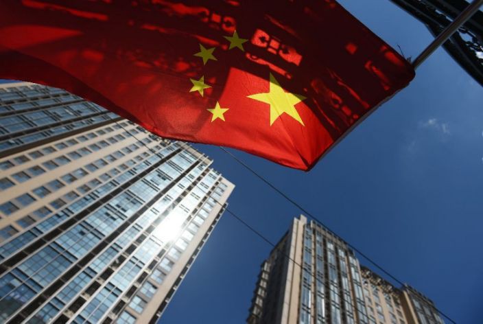 Nền kinh tế Trung Quốc được dự báo tăng trưởng hơn 8% trong năm 2021. Ảnh tư liệu: AFP