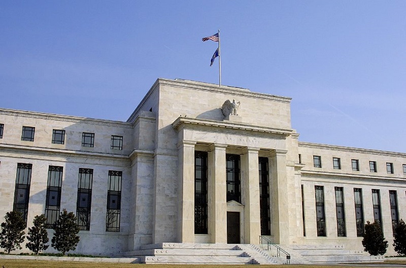 Fed hạ dự báo tăng trưởng năm 2021 của Mỹ xuống còn 5,9%, từ mức 7% công bố hồi tháng 6. Ảnh: AFP
