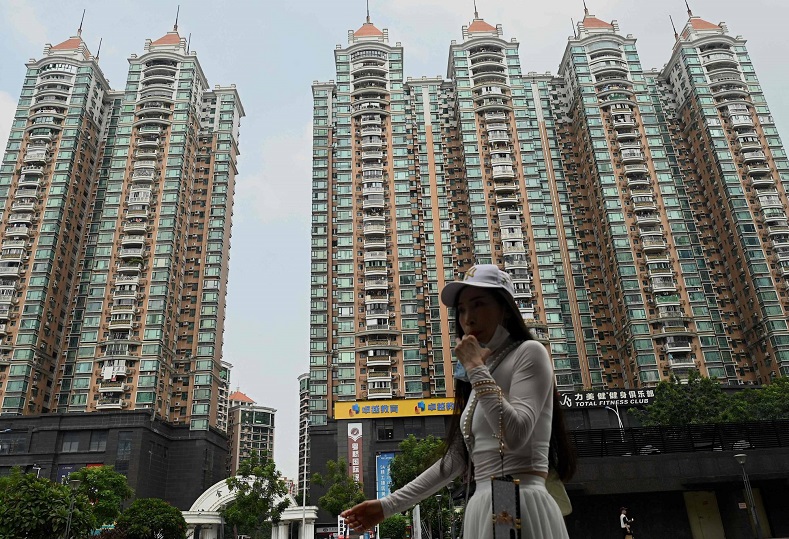 Chuyên gia từ Moody’s Investor Service cho rằng, vấn đề đáng lo ngại hiện nay là nền kinh tế Trung Quốc đang tăng trưởng chậm lại do sự suy thoái của ngành bất động sản nước này. Ảnh: AFP