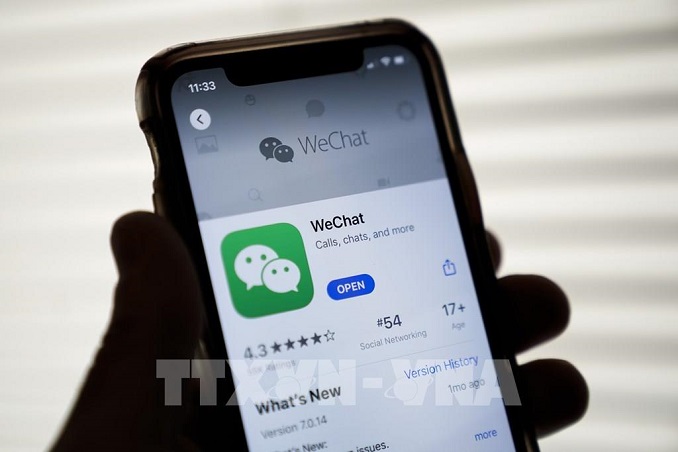 Biểu tượng WeChat trên một màn hình điện thoại chụp tại Washington, Mỹ. Ảnh: AFP/TTXVN