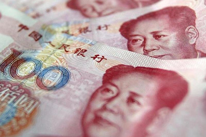 Đồng nhân dân tệ đã trượt giá khoảng 4% so với đồng đô la Mỹ kể từ đầu năm đến nay. Ảnh: AFP