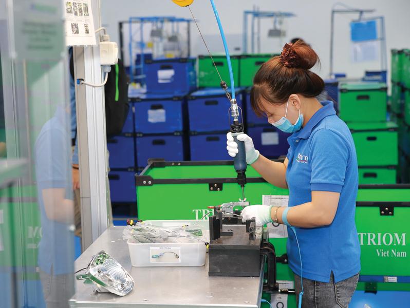 Nhà máy Triom (Italy) tại Khu công nghiệp Quang Minh (Hà Nội) chuyên sản xuất đèn chiếu sáng ô tô và xe máy. Ảnh: Đức Thanh