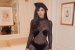 Kim Kardashian gây choáng với trang phục da báo xuyên thấu