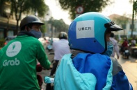Không thể võ đoán thương vụ Grab mua lại Uber