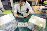 Fed tăng lãi suất: Dự trữ ngoại tệ mỏng dần, tỷ giá thêm căng