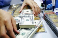 Quyết định hạ lãi suất của Fed như tin vui với tiền đồng, vàng SJC hồi phục sau cú giảm sâu