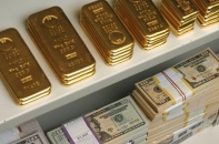 Vàng và USD giảm nhẹ phiên cuối tuần