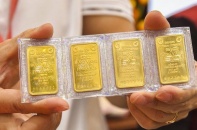 Vàng tiếp tục lao dốc dù Fed giảm thêm lãi suất USD