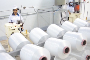 Thuế nhập khẩu xơ Polyester lên 2%, PVTEX có giảm tồn kho