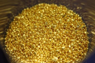 Giá vàng thế giới mất đà sau "cú đấm" của Fed