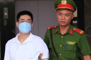 Bí ẩn chiếc cặp chứa 450.000 USD chạy án của cựu Phó giám đốc Công an Hà Nội