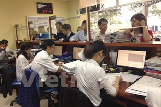 Hà Nội yêu cầu xử lý nghiêm chủ đầu tư thu phí cấp sổ đỏ trái quy định