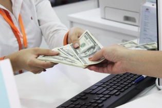 Việt Nam nới biên độ tỷ giá - giảm bất lợi khi Trung Quốc phá giá đồng tiền