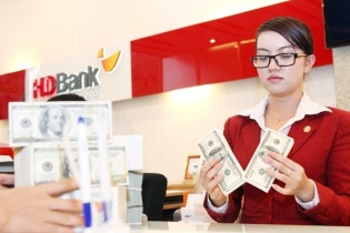 Tỷ giá USD tại Việt Nam có bị áp lực khi Fed tăng lãi suất 0,25%?