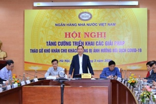 Ngành ngân hàng họp bàn cơ chế hỗ trợ người dân, doanh nghiệp bị ảnh hưởng bởi dịch Covid-19