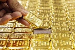 Vàng thế giới suy yếu trước sự hồi phục của USD