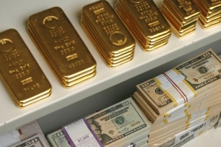 Vàng và USD giảm nhẹ phiên cuối tuần