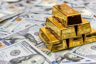 Vàng tiếp tục đà tăng, USD xuống mức thấp 