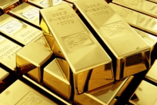 Vàng giảm nhẹ phiên cuối tuần vì USD mạnh lên