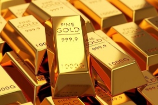 Vàng bật tăng mạnh sau khi Fed nâng thêm 0,25% lãi suất 