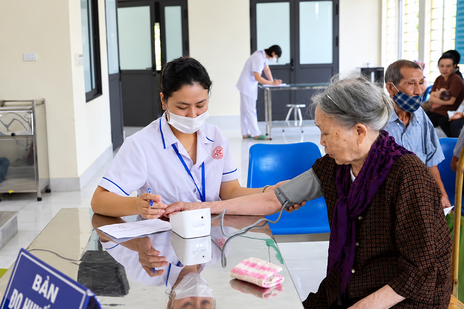 Nurse Recording an Elderly Patient&rsquo;s Blood Pressure